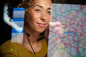 Woman looking at a map on a screen