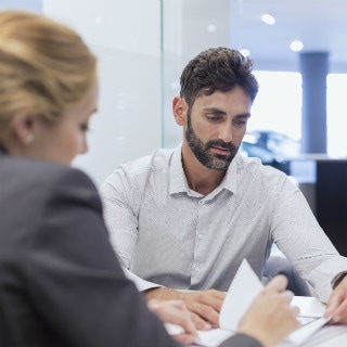 client meeting discussion documents man woman
