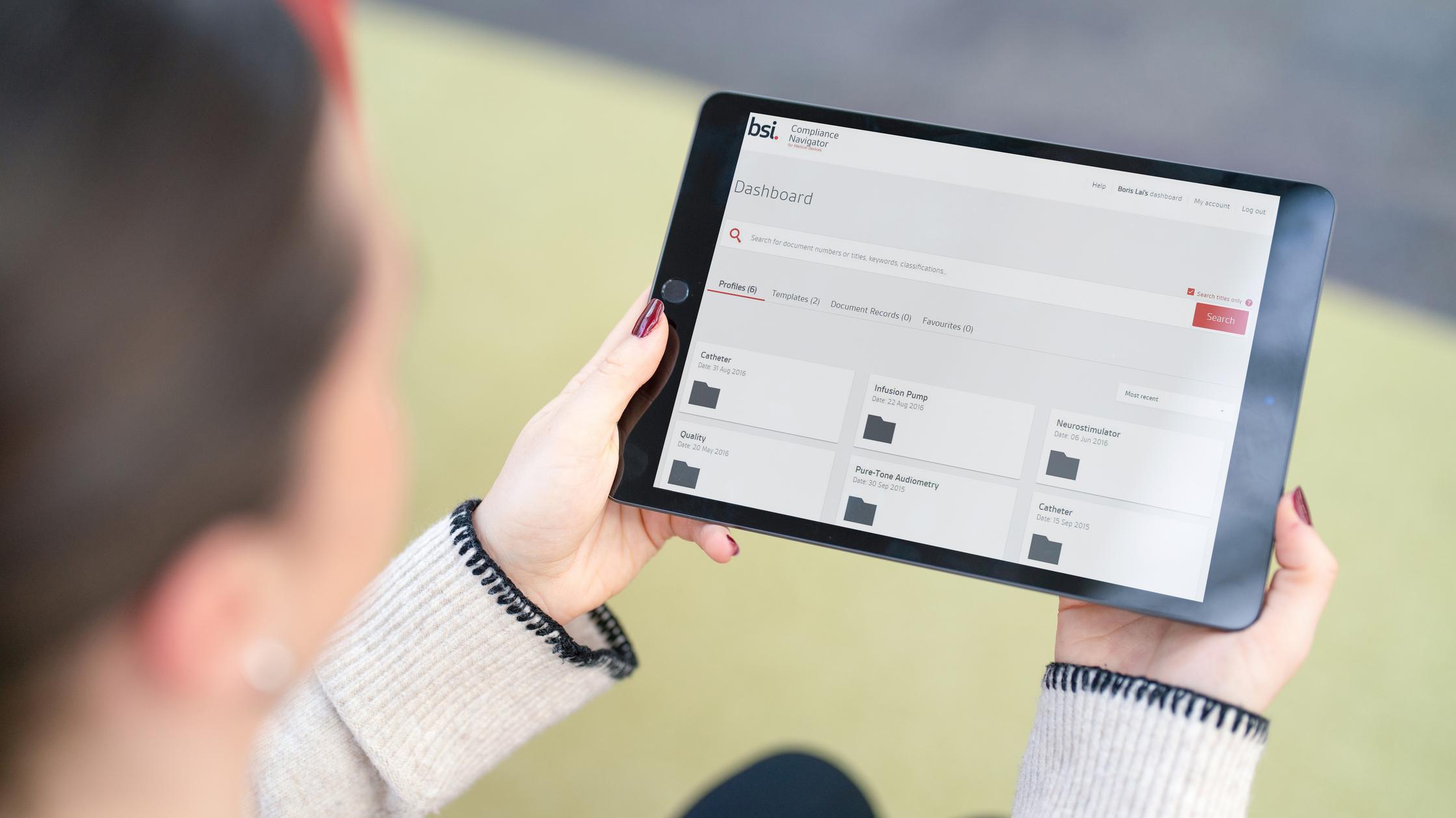 iPad with Compliance navigator dashboard mock-up