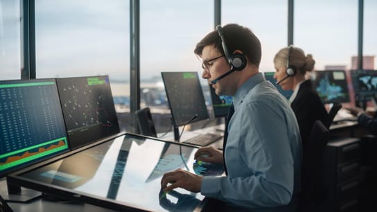 Air Traffic Controller with Headset Talk on a Call in Airport Tower. 