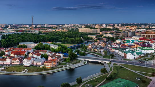 Aerial view of traditional eastern European buildings in Troitskoye Predmestje district of Minsk on Svislach river