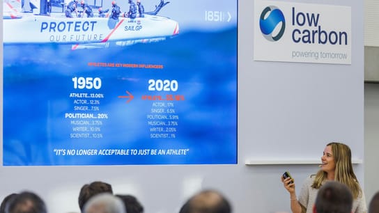 Hannah Mills, strategist of Great Britain SailGP Team, speaks at a Low Carbon conference alongside Roy Bedlow, CEO of Low Carbon.
