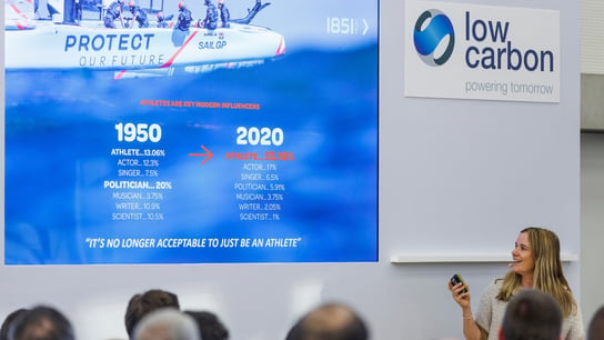 Hannah Mills, strategist of Great Britain SailGP Team, speaks at a Low Carbon conference alongside Roy Bedlow, CEO of Low Carbon.