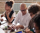 Workers collaborating with each other at office setting