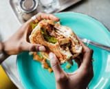 Person Holding Burger