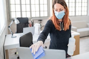 Masked worker in office setting