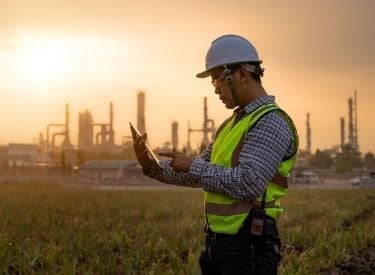 Man at a construction site inspecting details