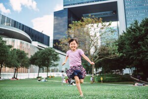 girl grass building