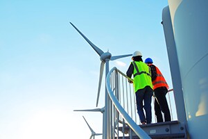 workers resting looking at windmills