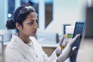 Woman in lab using tablet