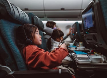 Child eating on a aeroplane