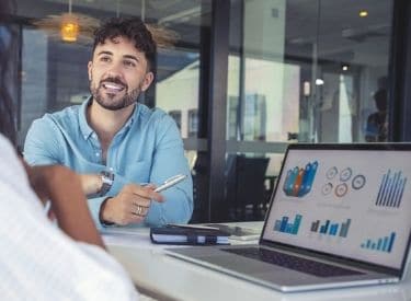 Man pointing at research dashboard