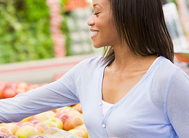 supermarket woman picking apple food