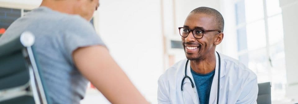 Doctor smiling at patient