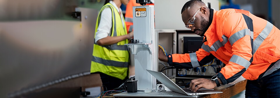 Engineers working in a machine workshop