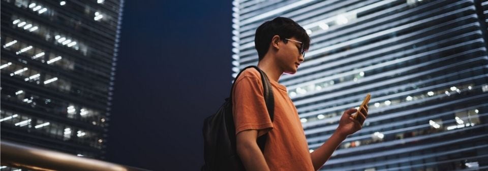 Man in  city with phone