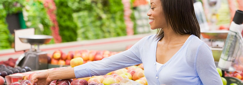 supermarket woman picking apple food