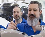 engineers examining air plane aerospace
            