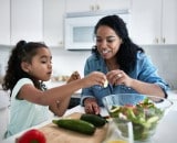 Mother and daughter preparing dinner