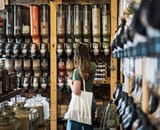 woman shopping in food re-fill shop