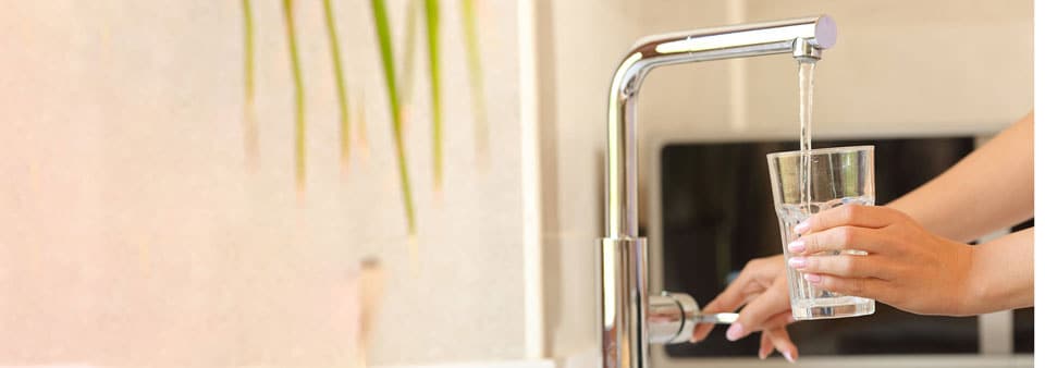 Filling glass up with water from tap