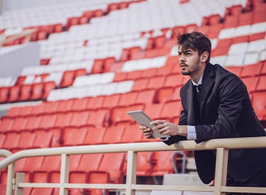 Event planner sat in a stadium Event planner sat in a stadium