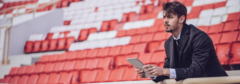 Event planner sat in a stadium