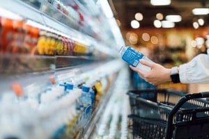 Picking bottle in supermarket