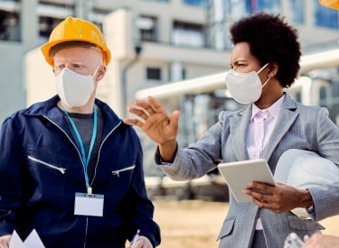 Engineers measuring building performance