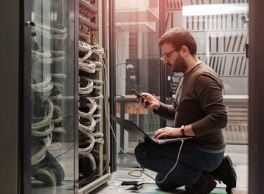 man in server room man in server room