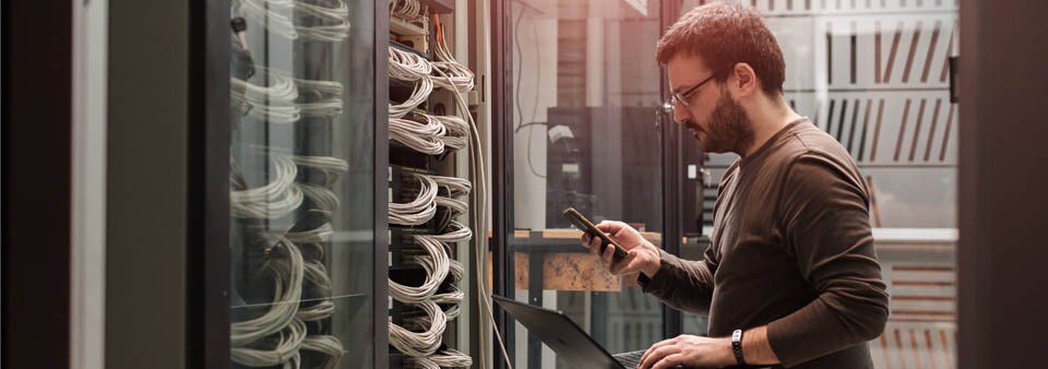 man in server room man in server room