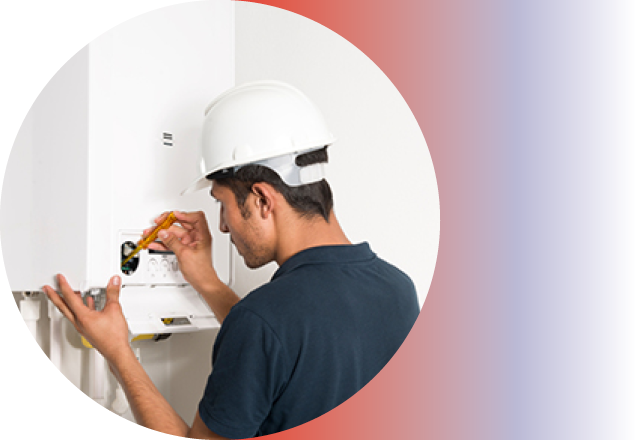 Image of a person fixing a boiler