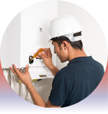 Image of a person fixing a boiler