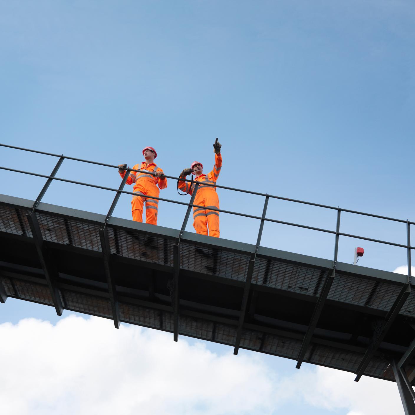 built environment two men on a bridge