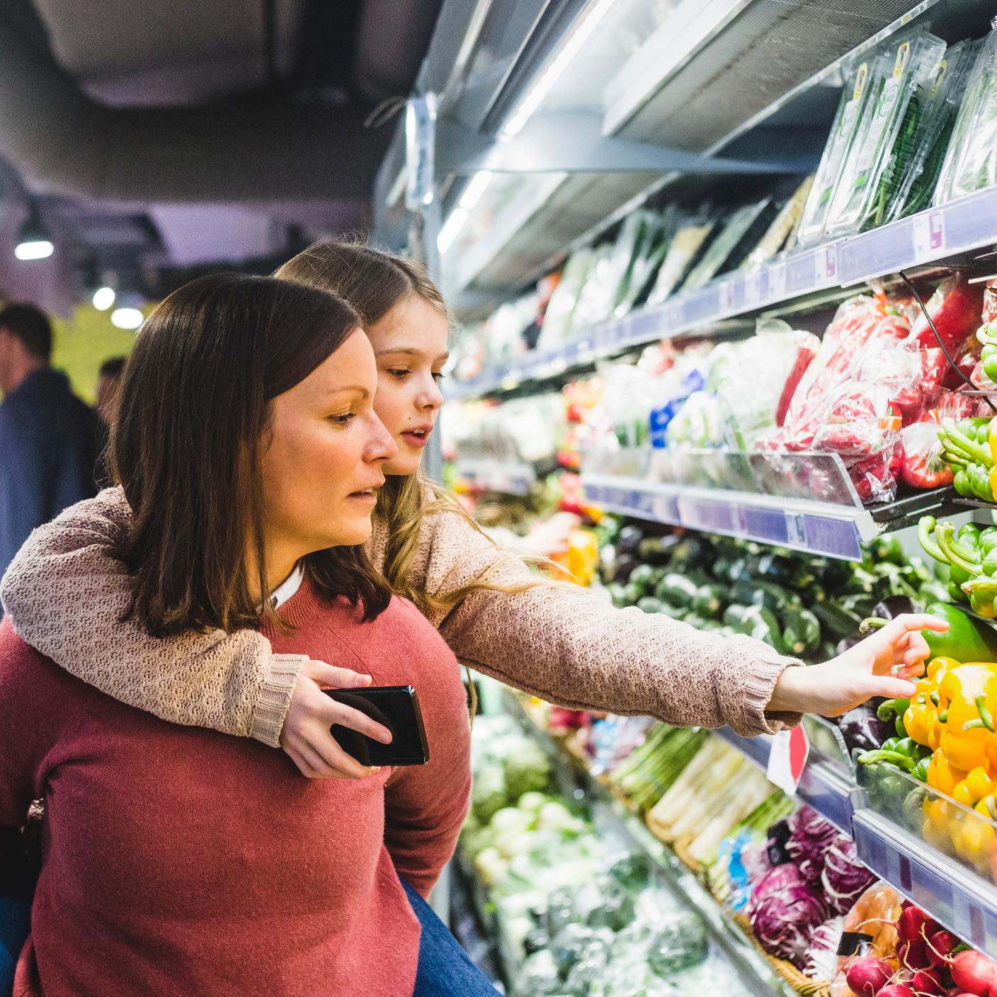 mother and daughter shopping off shelf