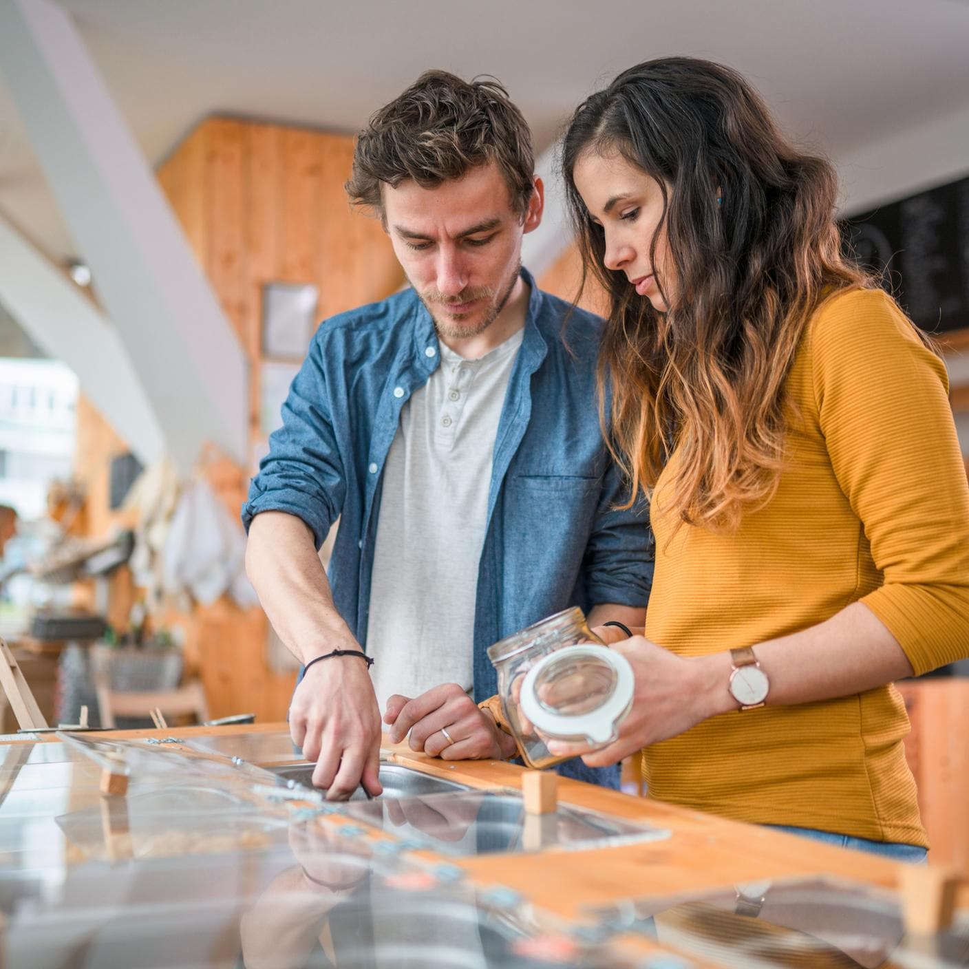 Sustainability in food and retail - couple using food jars