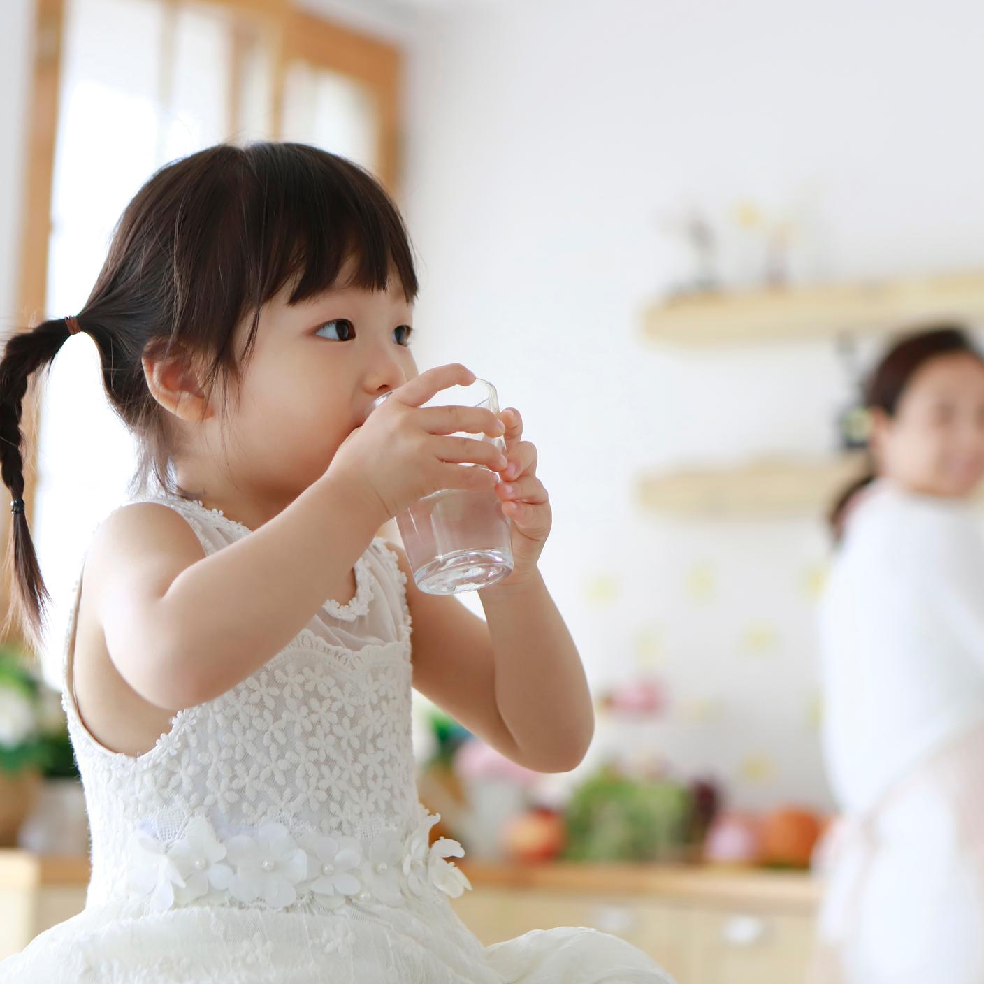 Girl drinking a glass of water