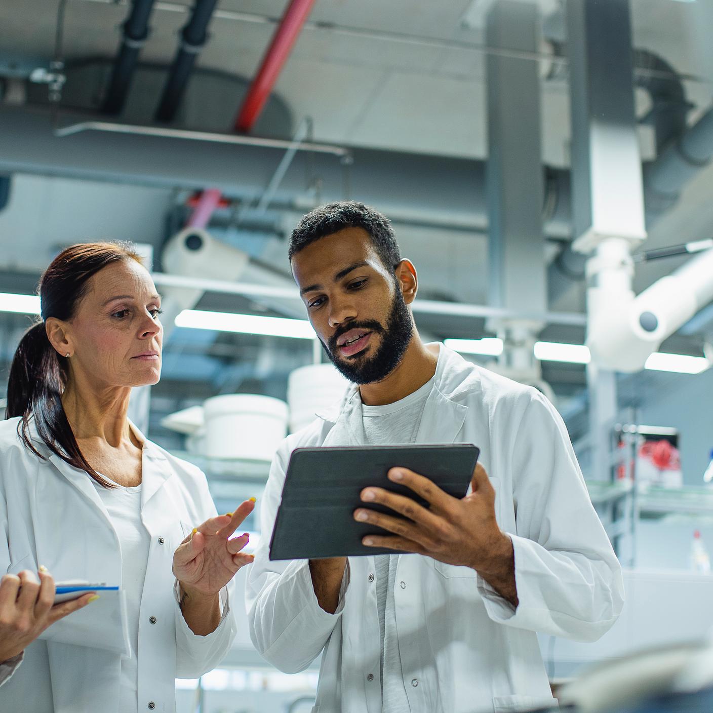 Digital trust in healthcare - scientists using tablet in lab