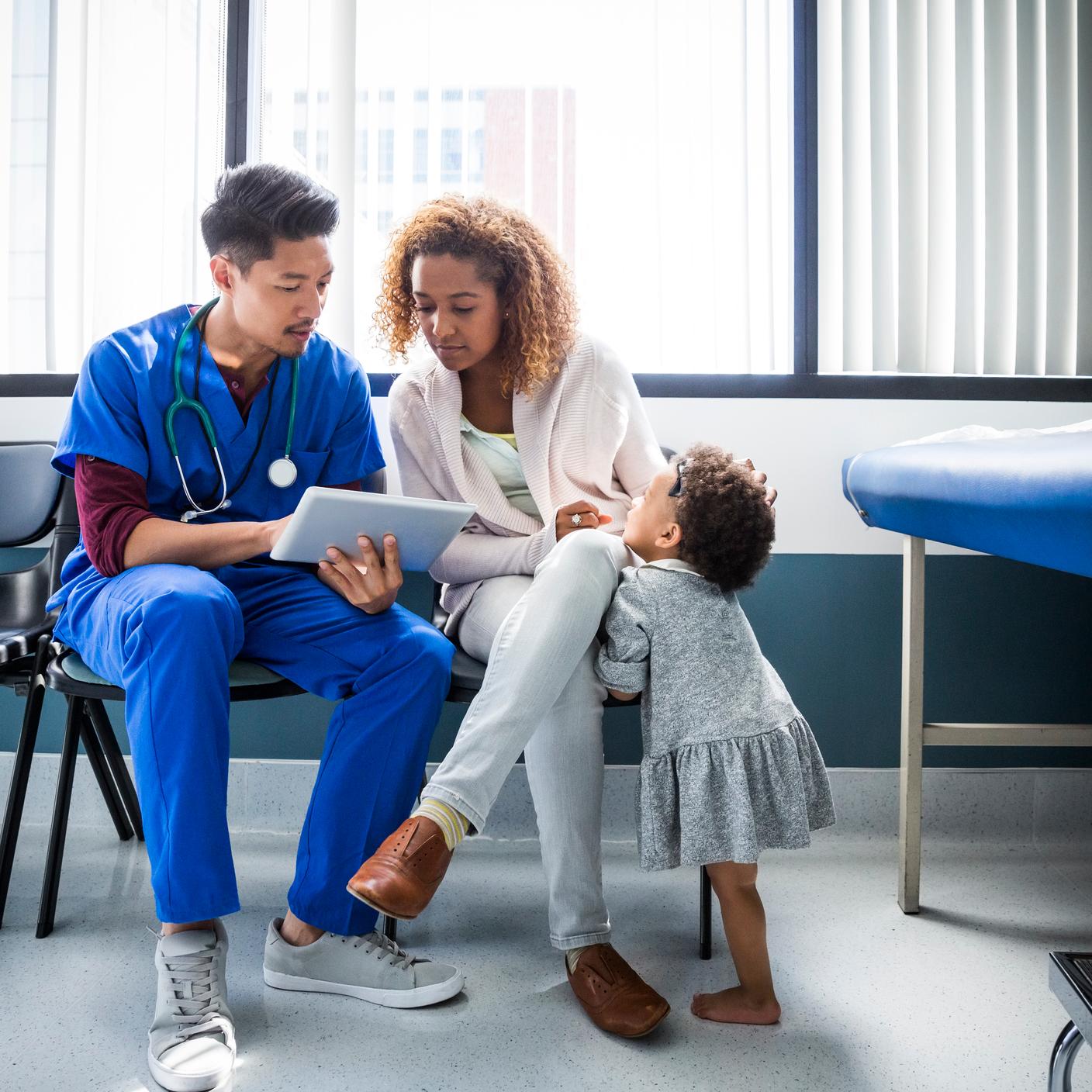 Digital trust - nurse with patient looking at chart