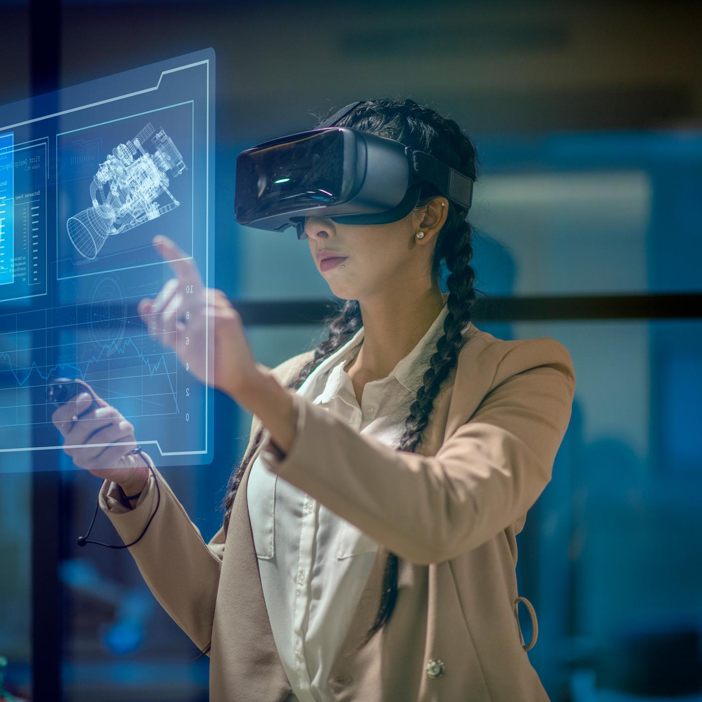 innovation report - Female engineer wearing a virtual reality headset at work