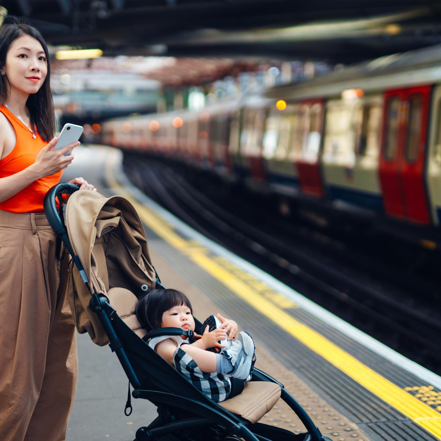 Digital Trust in the Built Environment - Mother travelling with toddler on public transport in the city