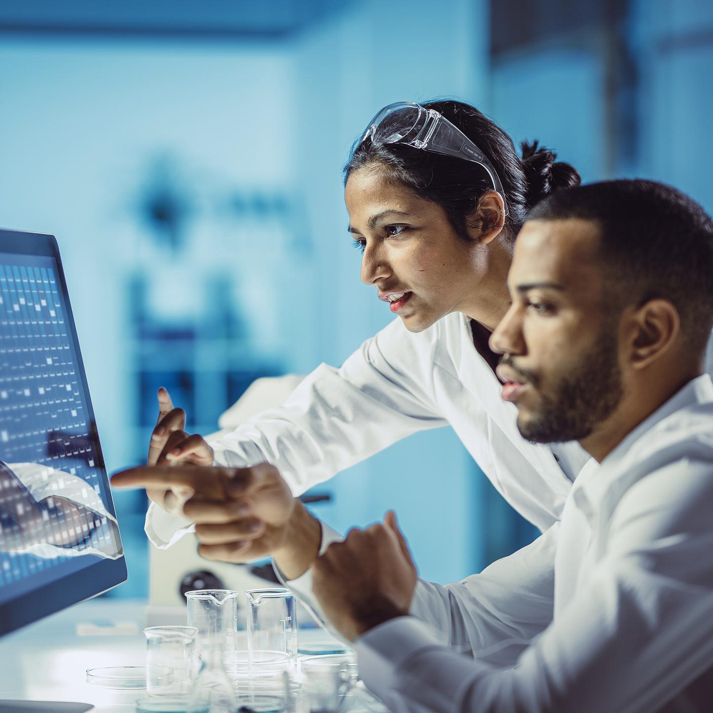 Innovation in Government - Scientists Working in The Laboratory, Using Touch Screen