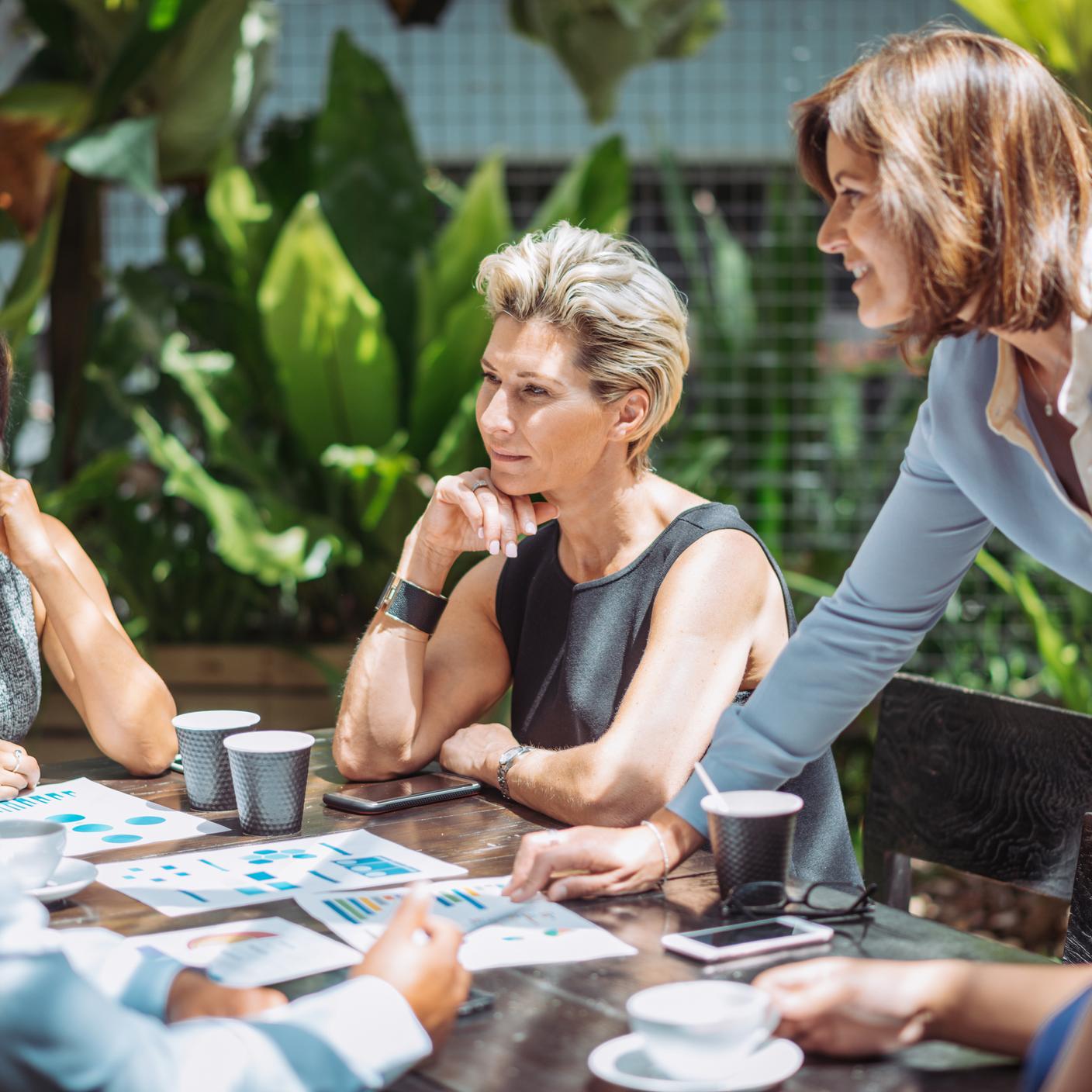 Female boss is finding solutions to overcome the existing challenges in company. 