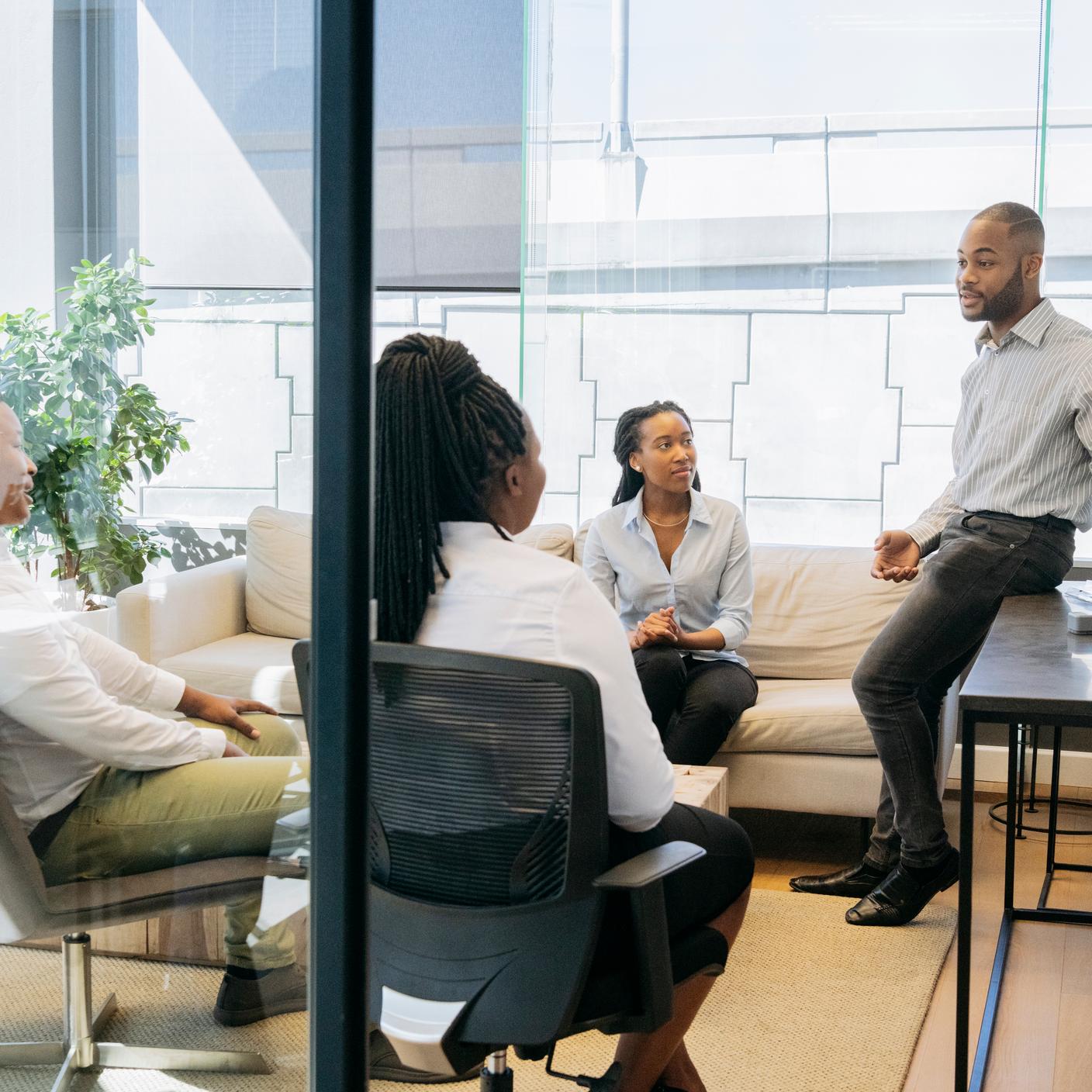 Diversifying Nigeria - african office workers in modern meeting room