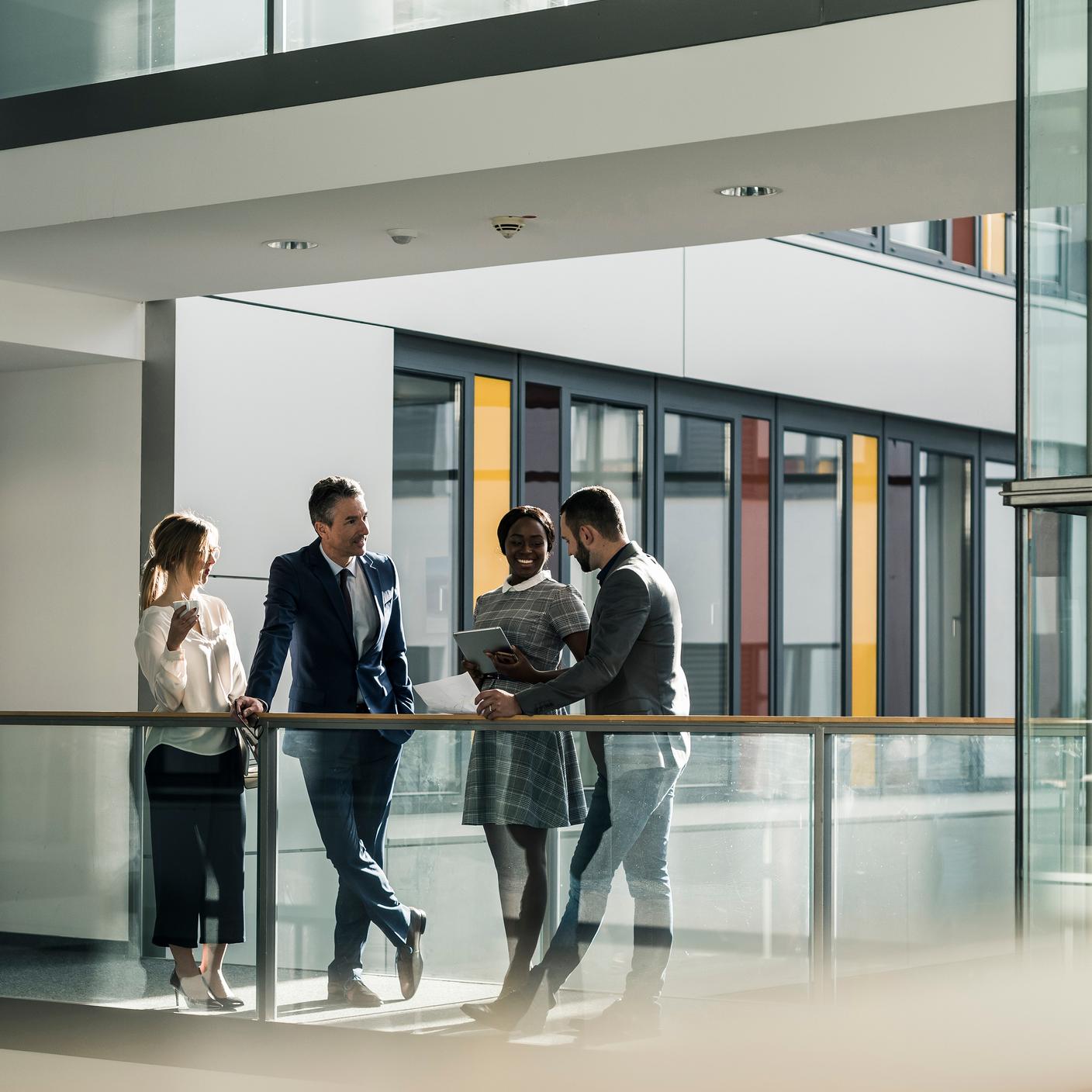 Standards that strengthen international trade - Business people talking on office floor