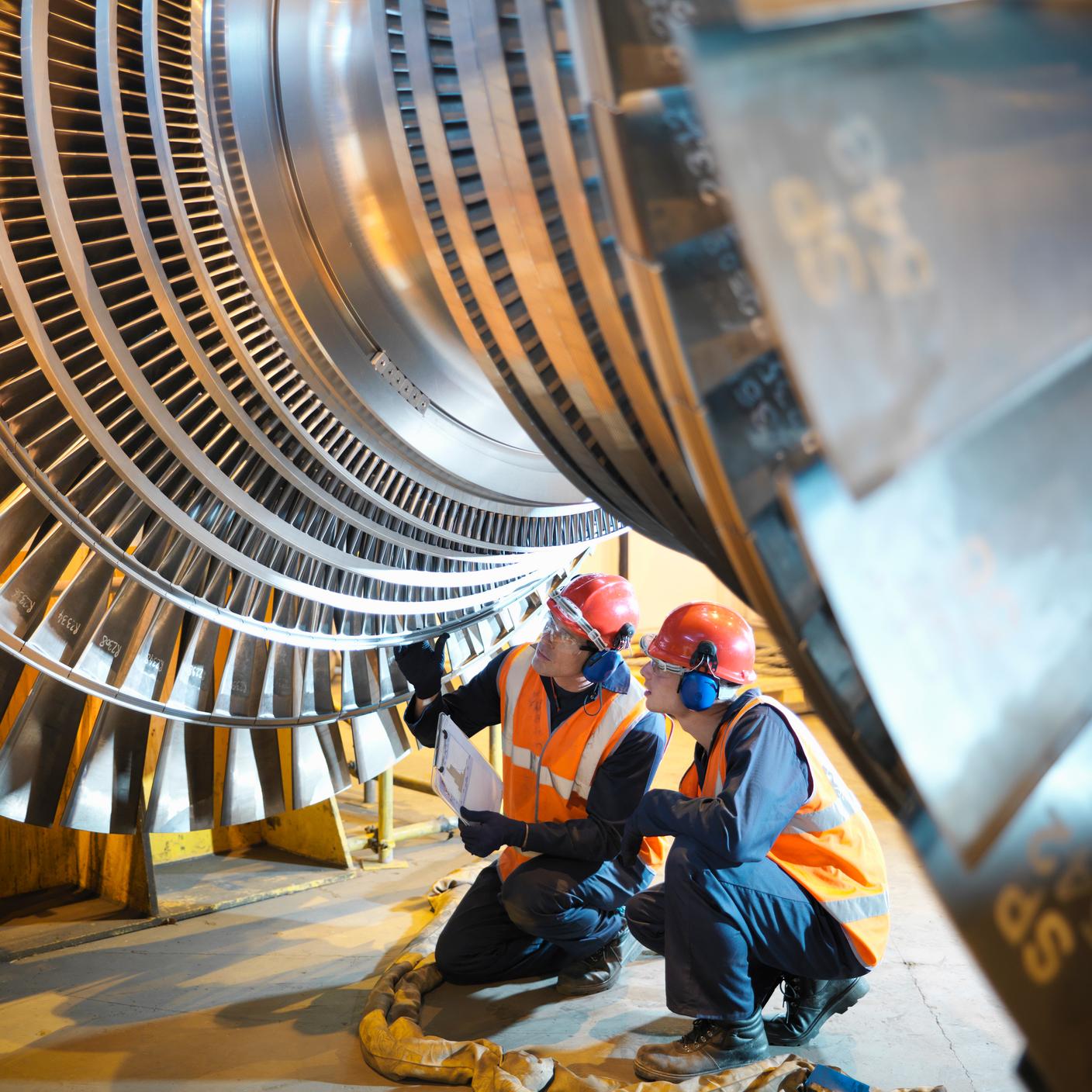 Health and safety - Workers inspect turbine in power station