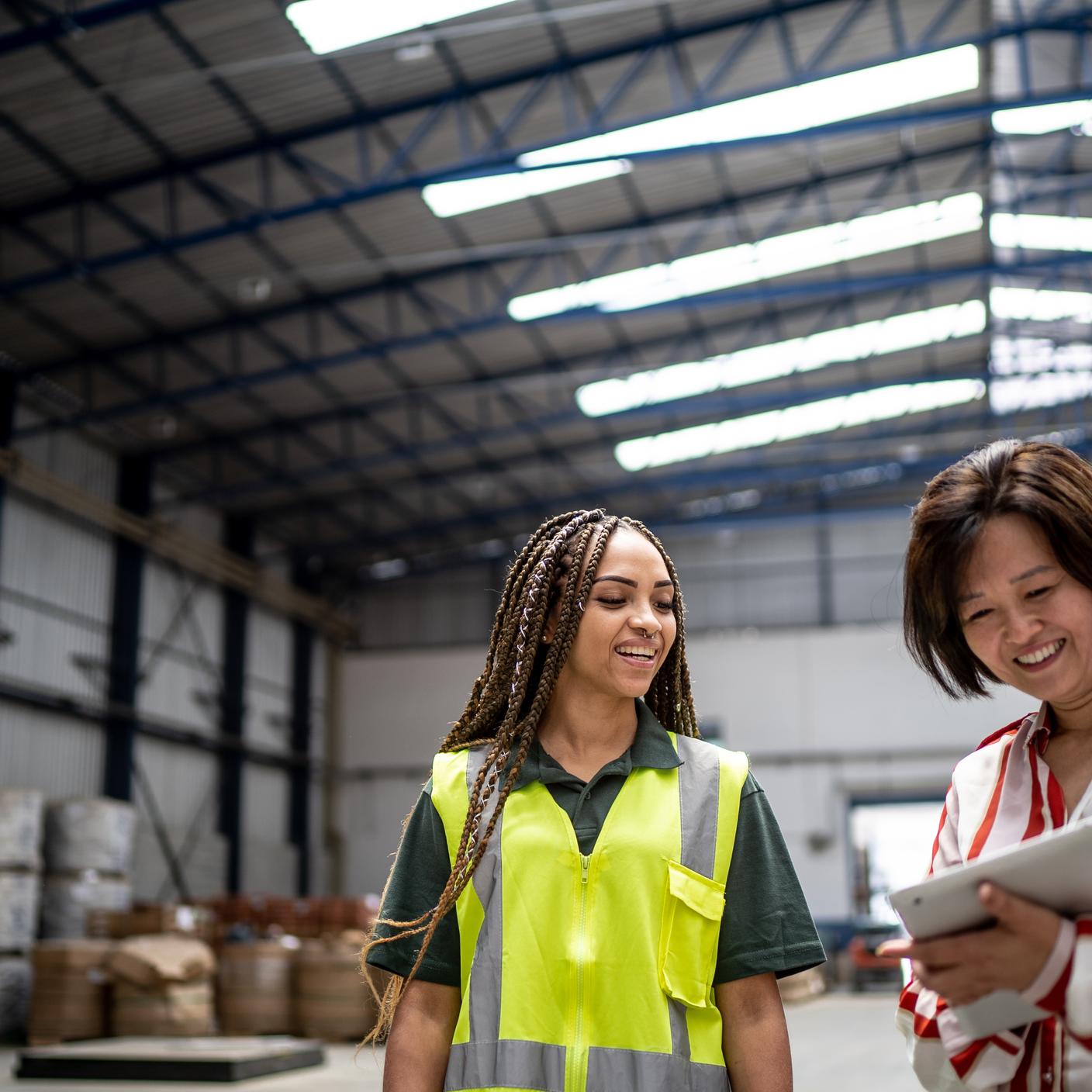 Making ‘Decent Work’ a habit in global supply chains - Manager talking to employee in a storage room