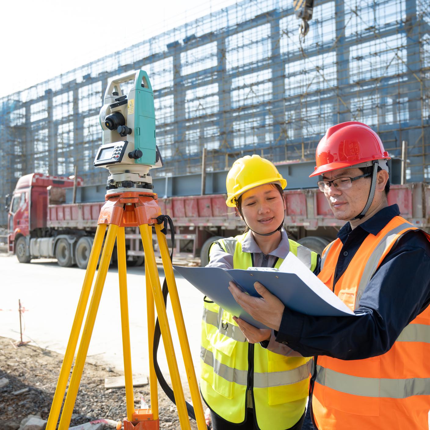 Engineers measure at a construction site in Fujian province, China