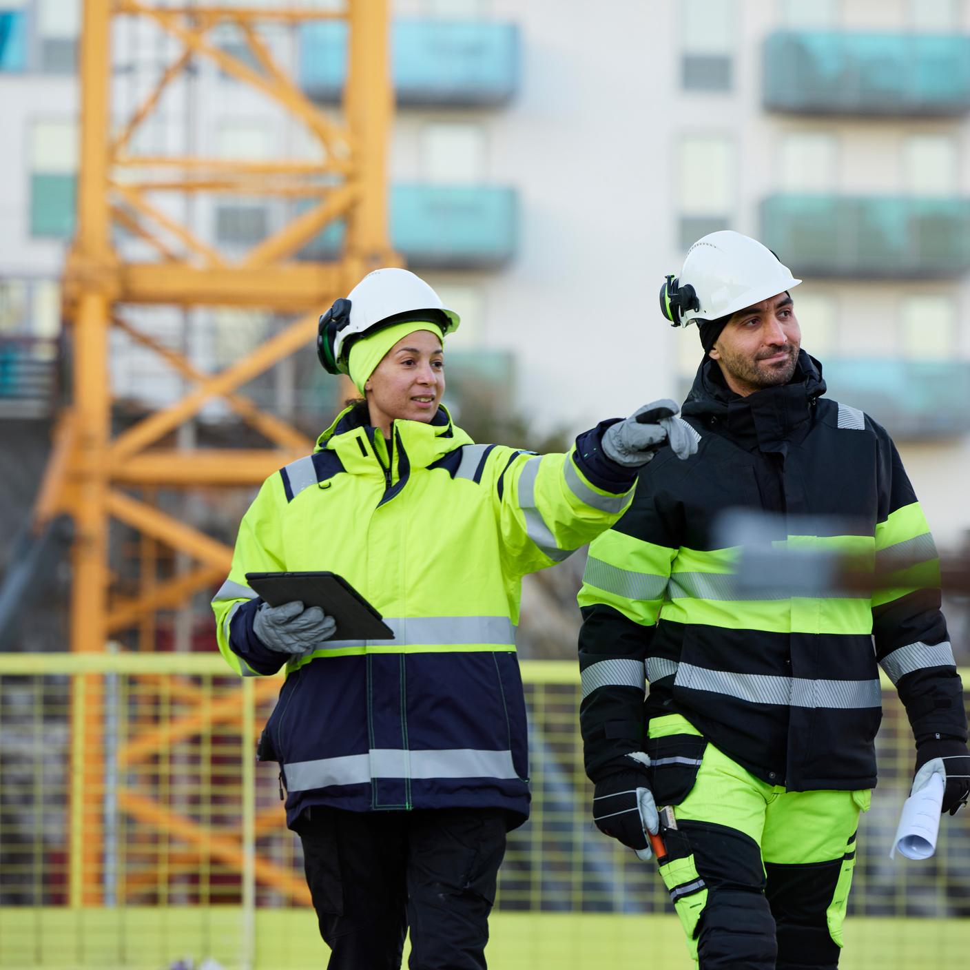 Construction engineers working at construction site