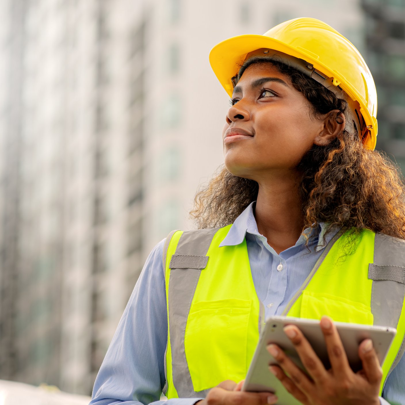 Female engineer is looking forward with determination